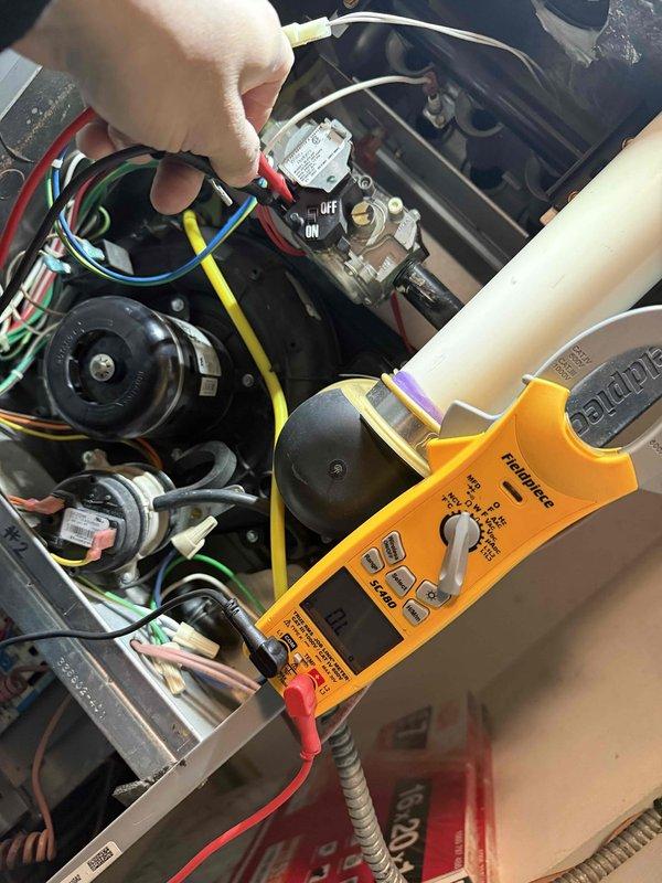 Performed diagnostic testing on furnace with no heat complaint. Conducted voltage measurements at gas valve using multimeter, recording 20.1V reading. Inspected electrical components, wiring connections, and blower assembly to identify cause of heating failure.