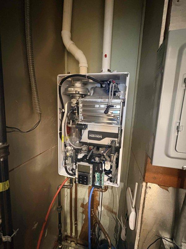 Performed annual maintenance service on Navien tankless water heater under Comfort Plan agreement. Inspected internal components, control board connections and verified proper operation of unit. Note: Customer's AC system has not yet been installed since January installation date.