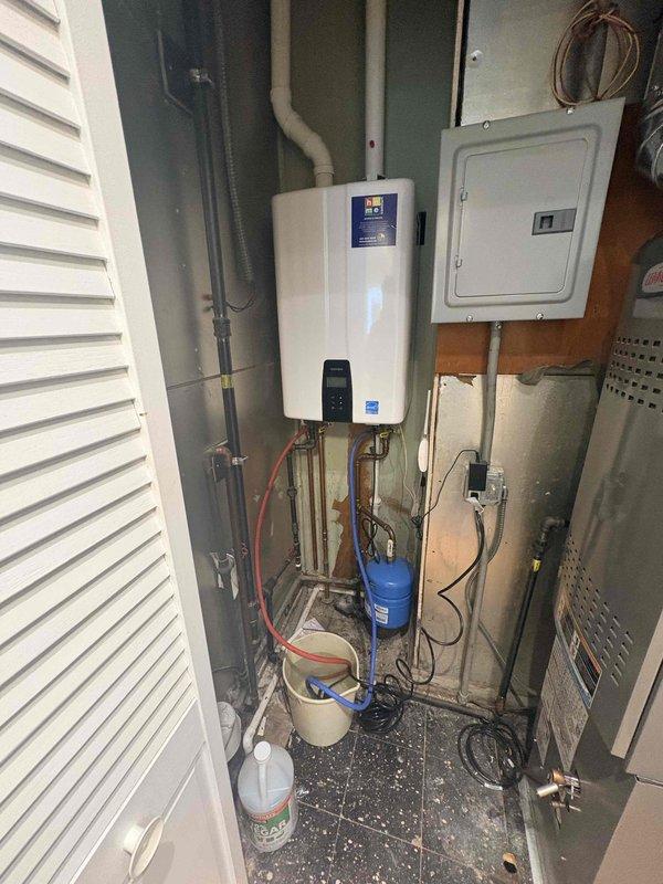 Performed annual maintenance service on Navien tankless water heater under Comfort Plan agreement. Inspected internal components, control board connections and verified proper operation of unit. Note: Customer's AC system has not yet been installed since January installation date.