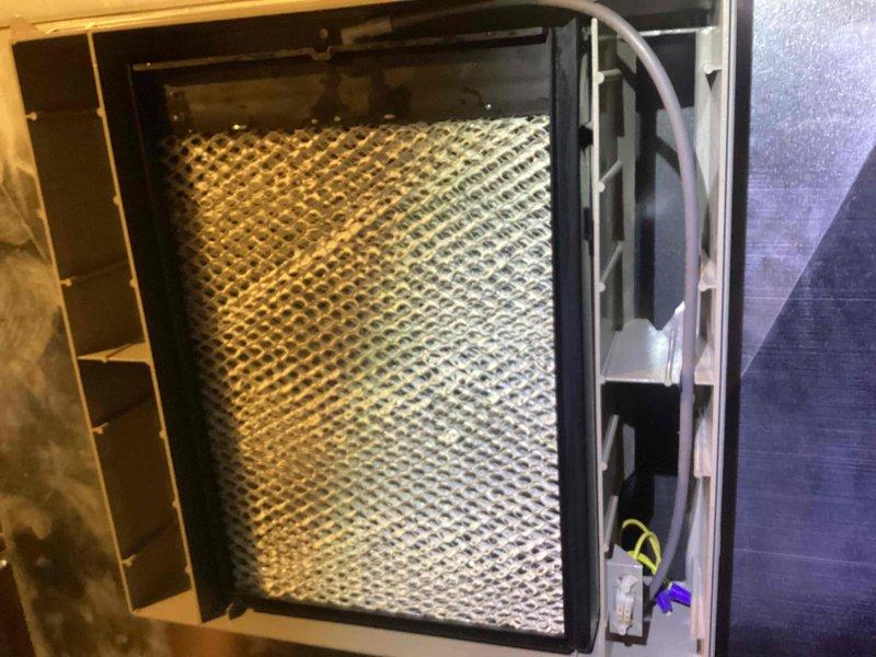 Performed annual Comfort Plan maintenance on Bryant HVAC system including furnace, tankless water heater, and humidifier. Inspected and replaced air filter which showed significant dust accumulation. System is functioning properly with all components in good working condition.