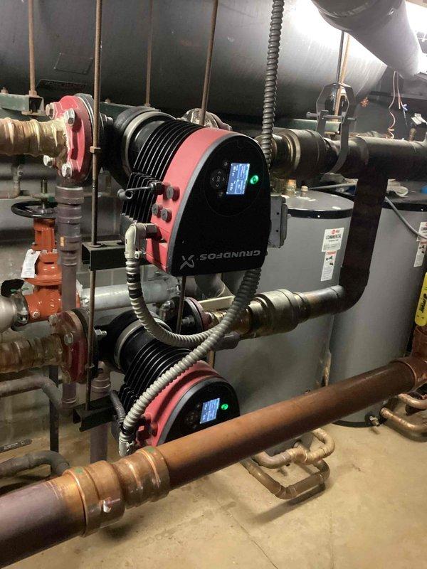 Diagnosed Central Heat Pump showing "Collect Continuation of time" error code on the MAGNUM3 control interface. Inspected system pressure (100 psig) and inlet readings (22.3ft) while verifying proper operation of the Grundfos circulation pumps, which were functioning normally with no visible issues in the hydronic distribution system.