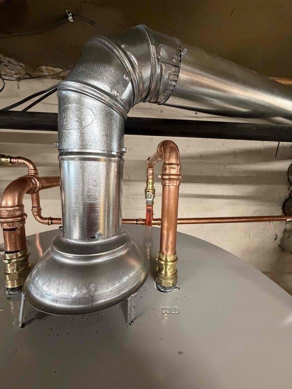 Successfully installed a new 50-gallon water heater in basement, replacing the existing unit. Connected to existing exhaust chimney, gas, electric, and water piping systems. Performed complete startup, testing, and safety inspection to ensure proper operation, with installation covered by 6-year warranty on functional parts and tank plus 1-year labor warranty.