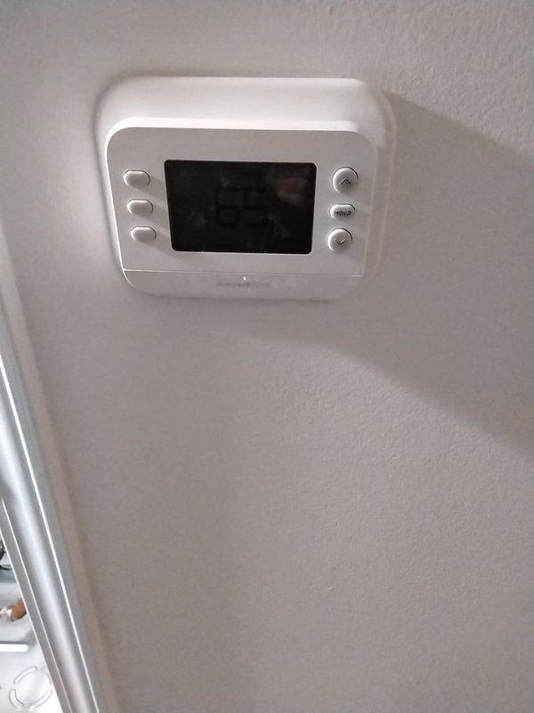 Completed de-watering procedure on water source heat pump and associated heat kit. Inspected electrical control panel connections, verifying proper termination of wiring at terminal board and relay/contactor. Confirmed functionality of digital thermostat interface and control system.