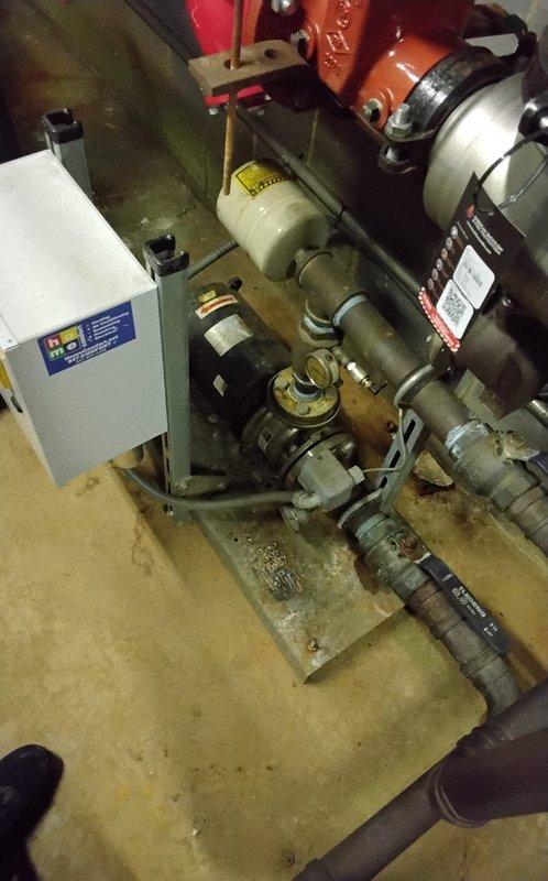 Responded to emergency call for high-rise building experiencing loss of water pressure on upper floors. Investigated booster pump system which was operational but producing abnormal noise; documented existing equipment for parts sourcing. Reset emergency kill switch as temporary measure while proper replacement components will be obtained when supply house reopens.