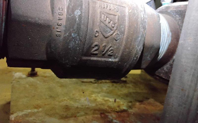 Returned to site to collect booster pump data as requested. Documented 2½" pipe fittings and connections with detailed photographs for reference. All components appear operational despite showing normal wear.