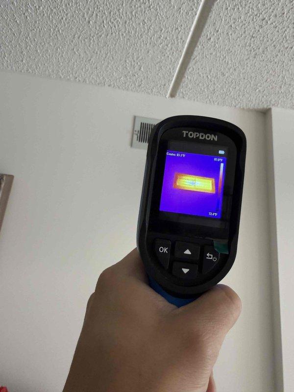 Responded to service call for non-functional thermostat stuck at 74°F with unresponsive controls. Performed thermal imaging diagnostics using TOPDON device to identify temperature differentials at register/vent areas, confirming actual ambient temperature of 72.9°F. Resolved control interface issue and restored normal thermostat operation.