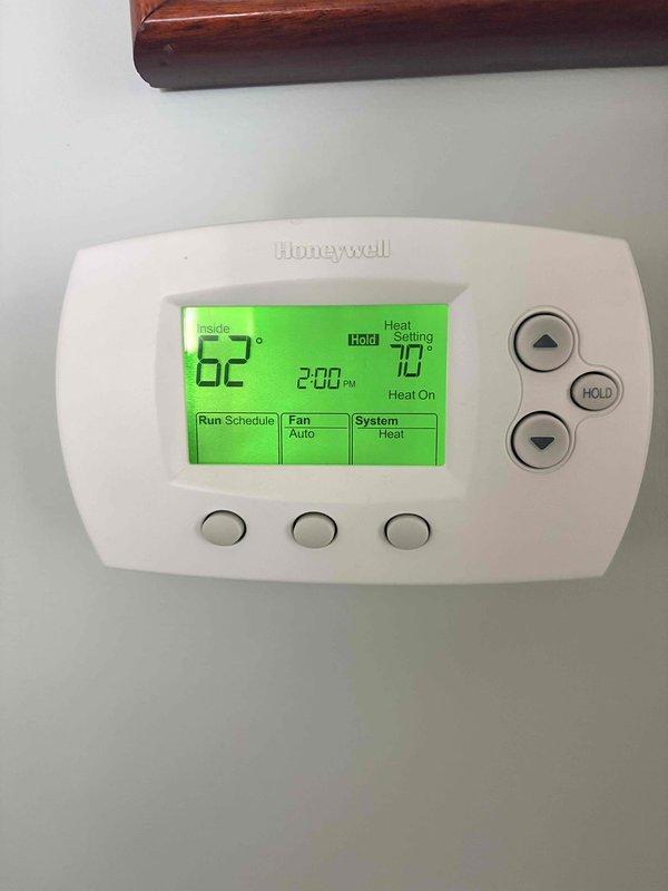 Responded to heat issue affecting only one floor of the customer's home. Inspected thermostat (Honeywell digital) which showed proper heat call settings with 62° actual temperature and 70° set point. Further investigation of furnace revealed flame sensor requiring cleaning, which was completed to restore proper ignition sequence and ensure consistent heating throughout the home.