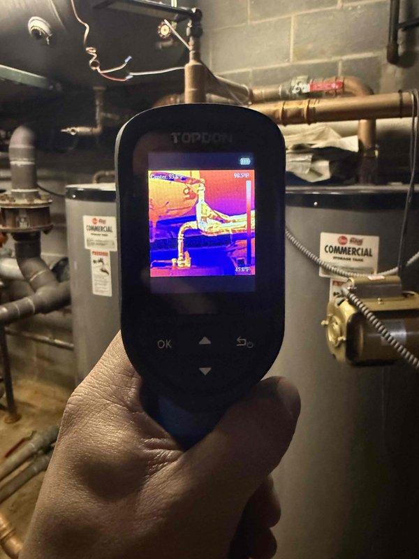 Responded to no hot water call at commercial property. Used thermal imaging to diagnose temperature issues in the water heating system, identifying significant temperature variations across the piping infrastructure. Successfully restored hot water service by resetting system switches and verifying proper operation of commercial water heaters.