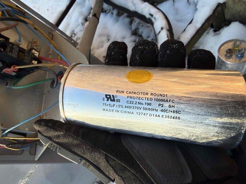 Replaced failed 75/5 μF 440/370V run capacitor in commercial HVAC unit. Documented installation with photos showing proper wiring connections to terminals. Partial payment collected; awaiting customer scheduling for remainder of invoice.