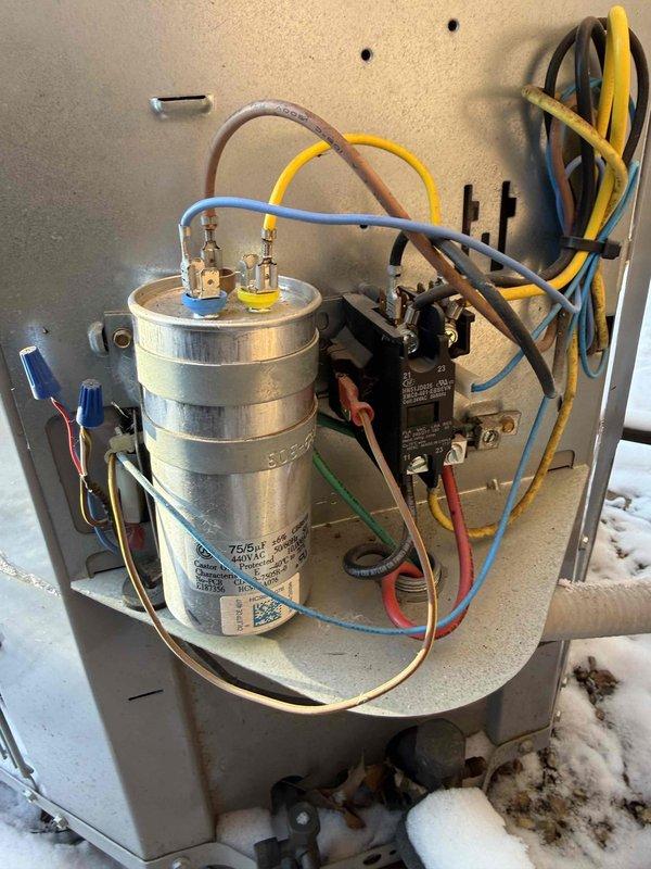 Replaced failed 75/5 μF 440/370V run capacitor in commercial HVAC unit. Documented installation with photos showing proper wiring connections to terminals. Partial payment collected; awaiting customer scheduling for remainder of invoice.