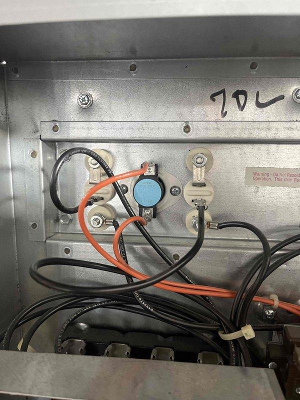 Completed installation of rectangular ductwork in commercial space per specifications, securing all sections with proper connections and labeling. Installed and wired control panel with proper terminal connections, including orange and black wiring to the primary sensor component marked "70L". All work performed according to building guidelines as marked on ceiling framework.