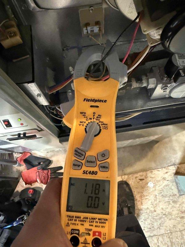 Responded to no-heat call for a 2017 furnace covered under 10-year parts and labor warranty. Performed diagnostic testing which revealed excessive dust accumulation on the blower wheel affecting system performance. Conducted electrical testing with Fieldpiece SC480 meter, confirming 1.18A current draw on motor circuit, which is within normal operating parameters. Cleaned blower assembly to restore proper airflow and heat distribution.