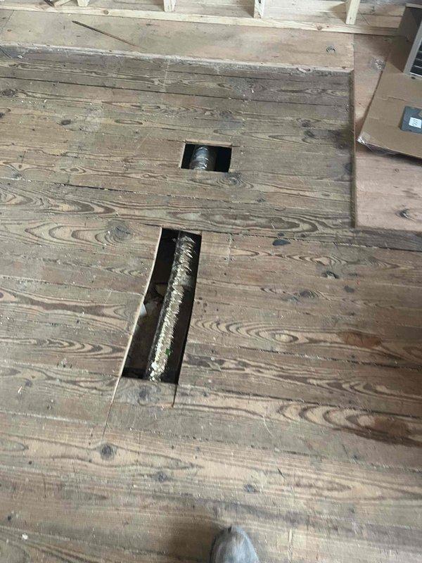 Completed Unico system modifications for third floor renovation, including rerouting existing return air and thermostat wiring to new mechanical closet. Installed five new supply runs through attic space for reconfigured bedrooms and bathroom. Repaired damaged second floor trunk line and redirected six existing supply runs through floor joists to connect with trunk line, ensuring proper airflow throughout the renovated spaces.