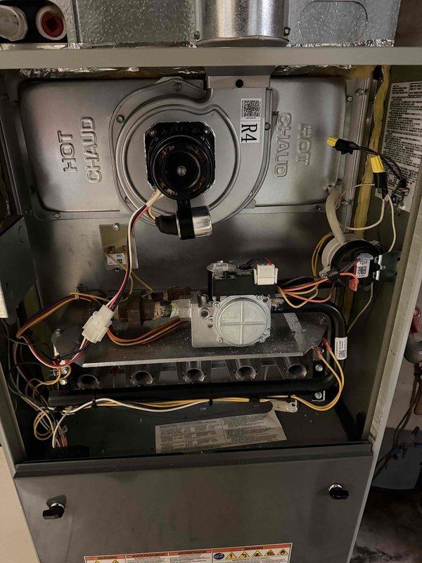 Completed warranty service by replacing faulty inducer motor and pressure switch on gas furnace. Documented installation with photos of internal components and verified proper system operation before returning removed parts for processing.