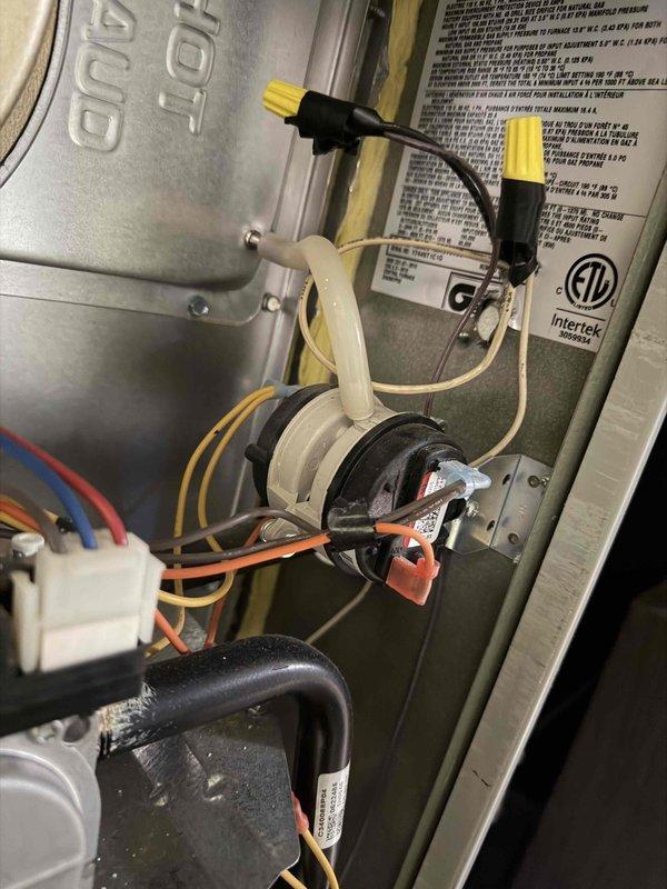 Completed warranty service by replacing faulty inducer motor and pressure switch on gas furnace. Documented installation with photos of internal components and verified proper system operation before returning removed parts for processing.