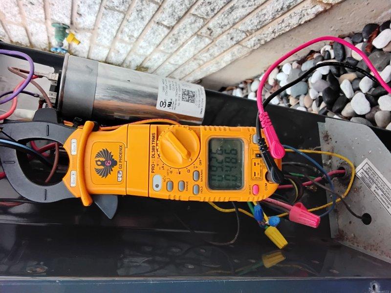 Performed complete Clean and Check service on AC system per Platinum Plan. Conducted electrical diagnostics using UEi Pro DL379 True RMS clamp meter to verify proper amperage and voltage readings across all components. Inspected outdoor condenser unit, which is properly installed on stone base with adequate clearance for airflow.