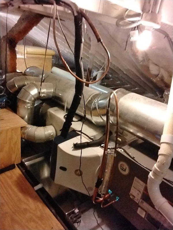 Performed isolation pressure test on the lineset under warranty. System was pressurized to 300 PSI to verify integrity of copper refrigerant lines. Documented installation with photos showing proper configuration of the residential HVAC system including ductwork, connections, and furnace unit.