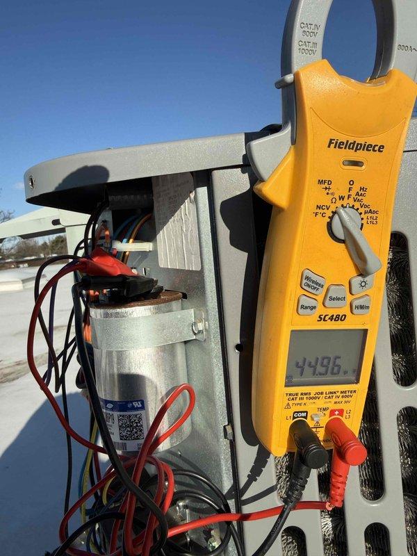 # Service Report

Completed spring commercial preventive maintenance inspection per contract service agreement checklist. Confirmed tenant availability prior to service as per protocol. Performed comprehensive system evaluation of outdoor HVAC unit including electrical diagnostics using clamp meter to verify amperage draw and capacitor performance. Measured compressor amp draw at 35.19 amps and tested capacitor reading of 4.936 MFD to ensure proper operation within manufacturer specifications. Documented current equipment information and filter specifications for maintenance records. Captured photographic documentation of electrical measurements and component conditions. Flagged any necessary updates to filter list for office records. Unit operating within normal parameters at time of service completion.