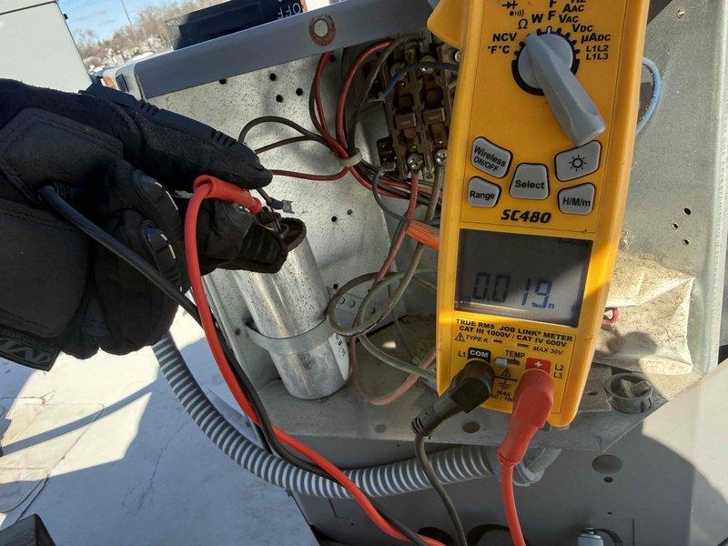 Completed spring preventive maintenance on commercial HVAC unit per contract service agreement. Verified tenant availability prior to service, performed comprehensive checklist inspection including filter examination and replacement documentation (noted previous service date 3/25/22), and conducted electrical diagnostics using multimeter to test capacitor and verify proper voltage readings on contactor assembly. Updated equipment information and filter specifications for maintenance records, photographed system components for documentation purposes.