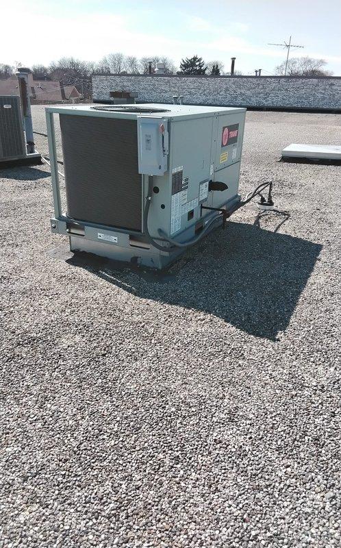 # Service Report: No Heat Call - RTU 1

Responded to return service call for no heat condition on rooftop unit serving middle office and showroom area. Unit had received maintenance service earlier in the week, after which heating operation ceased. Upon arrival, accessed RTU 1 on gravel ballast roof and performed diagnostic evaluation of packaged HVAC system.

Conducted visual inspection of unit exterior and opened service panel to access electrical components and controls. Examined disconnect box and internal wiring for loose connections or tripped safeties that may have occurred following recent maintenance work. Verified power supply to unit and checked voltage at disconnect. Inspected gas valve, ignition system, and flame sensor for proper operation and positioning, as these components are commonly affected during routine maintenance procedures.

Tested heating sequence through thermostat call and monitored unit startup. Evaluated blower motor operation, limit switches, and pressur