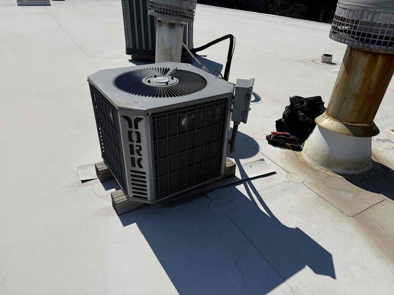 # Service Summary

Completed spring preventive maintenance inspection on commercial rooftop HVAC equipment including York condenser unit and cylindrical air conditioning unit. Performed comprehensive checklist evaluation, documented current equipment specifications and filter information, captured photographic documentation of all units and their operating conditions, and flagged necessary updates for filter list maintenance records.
