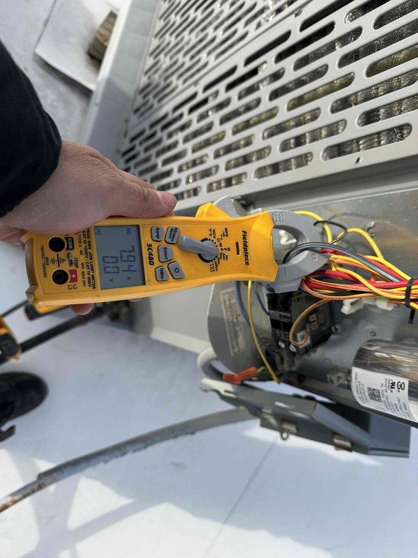 Completed spring preventive maintenance on commercial rooftop York air conditioning unit per prepaid service agreement. Performed comprehensive checklist inspection, verified tenant availability prior to service, captured updated equipment information and filter specifications, and conducted electrical diagnostics with amperage readings of 15.2A on motor components.