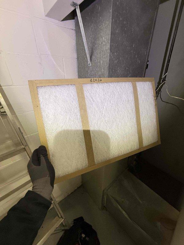 Completed spring preventive maintenance on commercial HVAC system including filter replacement and equipment inspection. Replaced air filter in air handler unit and performed electrical component inspection on outdoor condenser unit, noting capacitor showing signs of corrosion and discoloration that may require future replacement. Updated equipment and filter specifications per maintenance protocol.