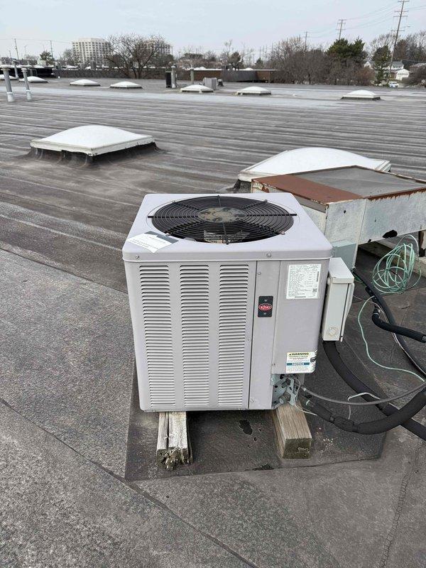 Completed spring preventive maintenance on commercial rooftop HVAC unit, performing comprehensive checklist inspection of condensing unit including fan operation, electrical connections, and refrigerant levels. Documented equipment specifications and filter dimensions, noting filter dated 2.5.22 requires replacement, and updated maintenance records with current equipment information for future service tracking.