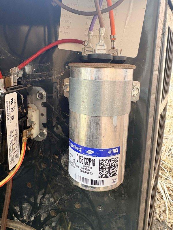 Completed annual air conditioning clean and check per Gold Comfort Plan agreement. Performed comprehensive inspection of residential split system including indoor furnace unit and outdoor condensing unit. Inspected and tested dual-run capacitor, contactor, and electrical connections at outdoor unit—all components operating within normal parameters. Verified proper refrigerant charge, checked condensate drain lines for proper flow, and inspected ductwork and connections. System tested under load and confirmed cooling operation with no deficiencies noted.