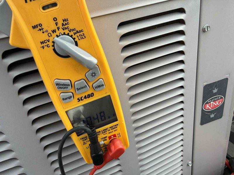 Completed spring preventive maintenance on commercial Weather King HVAC unit. Performed comprehensive system inspection per checklist, recorded updated equipment specifications and filter information, and took electrical measurements using clamp meter to verify proper system operation. All findings documented with photographs for service records.