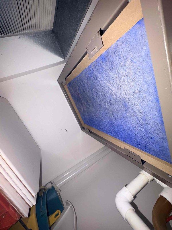 Responded to service call for reported short-circuiting issue and continuously running fan. Upon arrival, inspected Honeywell ProSeries programmable thermostat and found system operational with proper display function showing 73°F in heating mode with fan set to auto. Verified air handler installation with active 5-year parts warranty (installed 2019) and condensing unit with 10-year parts warranty. Inspected air handler unit and confirmed pleated air filter installed and accessible, with evaporator coil and condensate drain lines in satisfactory condition.