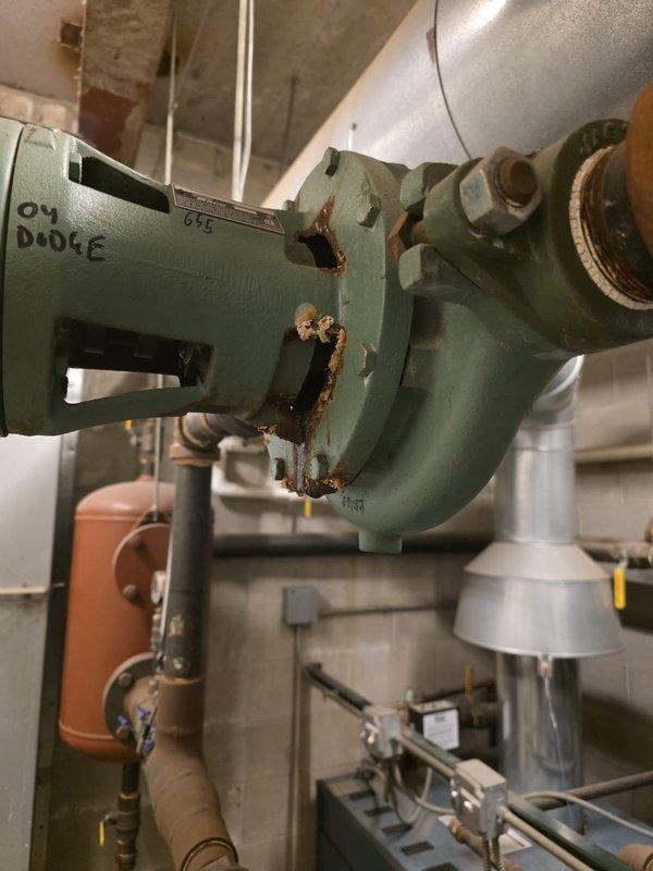 Conducted site assessment of mechanical equipment at multi-building condominium complex to evaluate maintenance needs and equipment condition for potential service agreement. Inspected Taco circulation pump assembly serving building 655, noting advanced corrosion on pump housing, valve connections, and mounting brackets with significant rust deterioration around joints and fittings. Documented equipment age, wear patterns, and maintenance requirements through photographic documentation. Reviewed additional mechanical systems throughout the property to prepare comprehensive repair and replacement recommendations as requested by the board for transition from current maintenance provider.