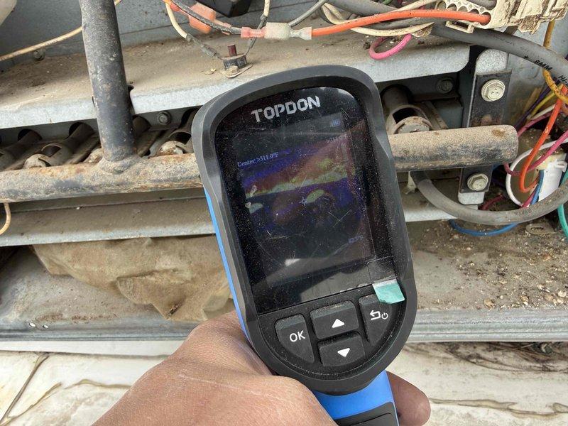 Responded to no heat call on commercial RTU. Upon arrival, performed diagnostic inspection using thermal imaging equipment to identify temperature variations and heat distribution issues throughout the system and supply air. Inspected flame sensor, burner assembly, and ignition components, noting previous cleaning had been performed on flame sensor in February. Conducted temperature readings showing supply air at 111-115°F, confirming heat operation restored. System operational at time of departure.