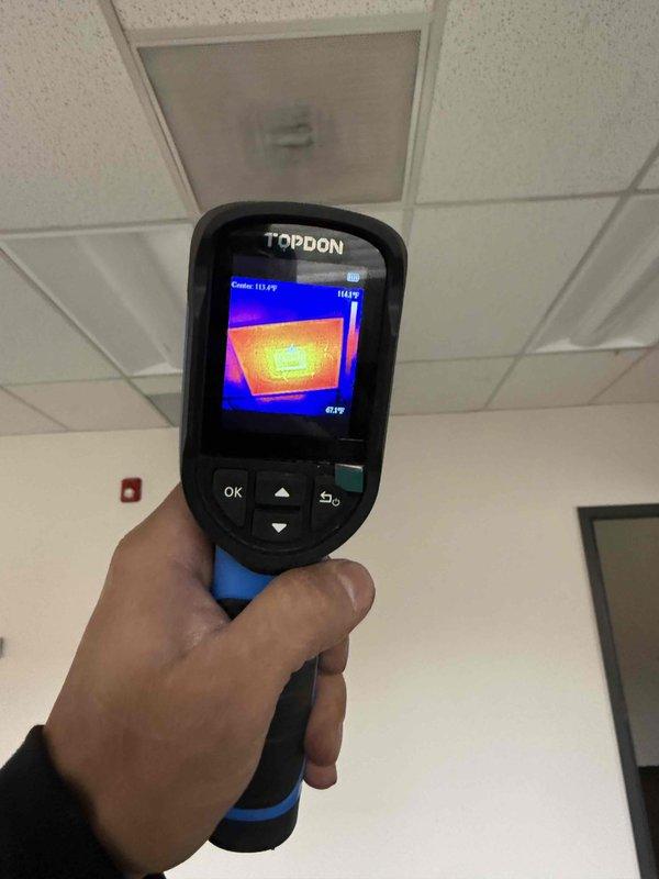 Responded to no heat call on commercial RTU. Upon arrival, performed diagnostic inspection using thermal imaging equipment to identify temperature variations and heat distribution issues throughout the system and supply air. Inspected flame sensor, burner assembly, and ignition components, noting previous cleaning had been performed on flame sensor in February. Conducted temperature readings showing supply air at 111-115°F, confirming heat operation restored. System operational at time of departure.