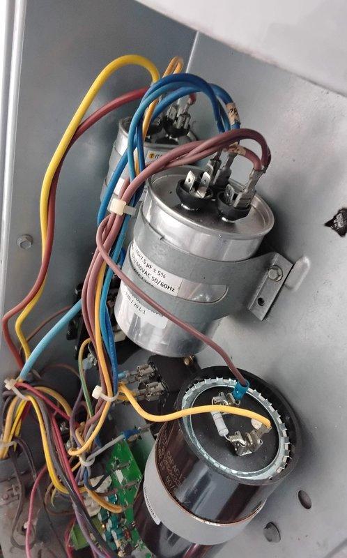 Replaced two failed capacitors on commercial HVAC unit as previously diagnosed: one 40/5 MFD dual run capacitor and one 35/5 MFD dual run capacitor. Verified proper electrical connections, tested system operation, and confirmed unit returned to normal functionality. Collected outstanding invoice payment and discussed seasonal boiler shutdown options with facility management.