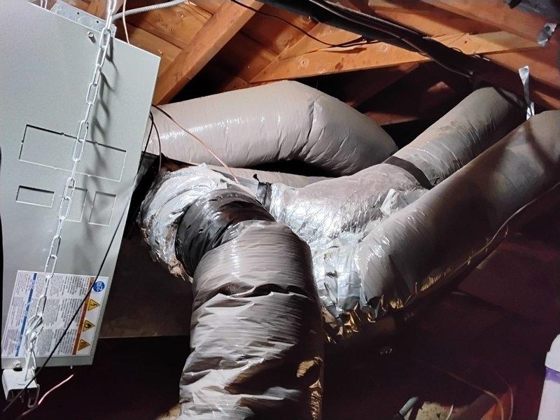 Removed existing supply runs and return ductwork from attic space and replaced with new insulated flexible ductwork. All new supply ducts were properly installed with reflective insulation wrapping to improve system efficiency and temperature control. Connected ductwork to existing air handler unit, ensuring proper sealing and support throughout the attic space to restore optimal airflow distribution to the conditioned areas.