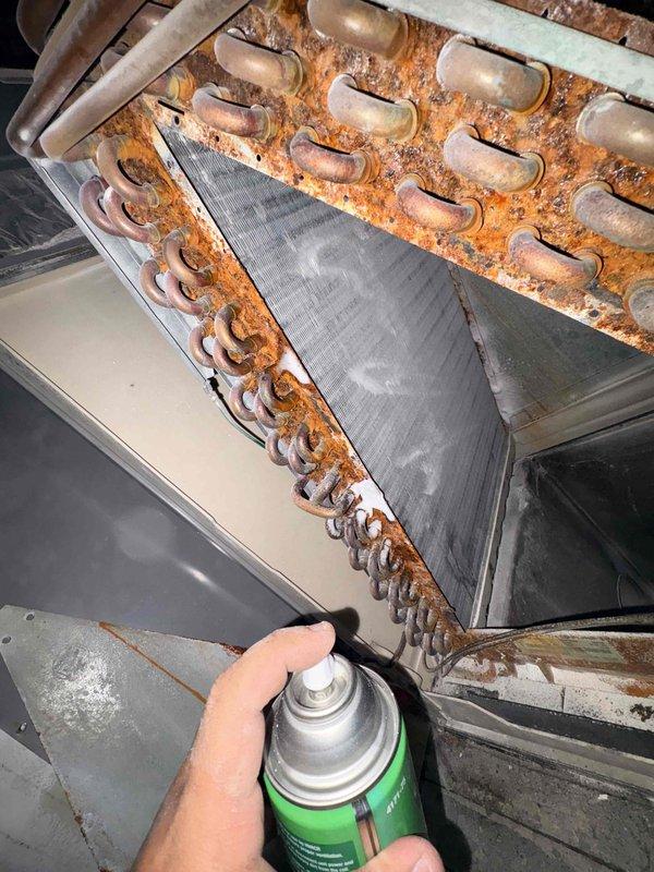 Performed comprehensive cleaning service on residential HVAC system addressing heavily corroded evaporator coil and contaminated blower assembly. Removed and performed advanced cleaning of blower assembly, extracting accumulated debris and buildup from blower wheel and housing. Opened access panel to evaporator coil and executed deep cleaning using power washer and brush to address severe corrosion and oxidation on copper tubing and coil surfaces. Cleaned secondary heat exchanger to restore proper heat transfer efficiency. All components were reassembled and system tested for proper operation upon completion.