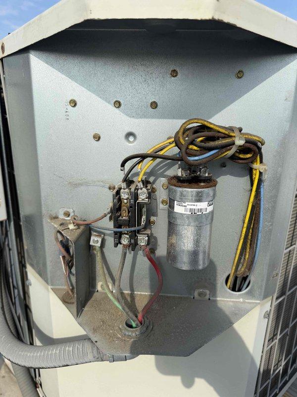 Completed spring preventive maintenance on commercial rooftop HVAC unit. Confirmed tenant availability prior to service, performed comprehensive checklist inspection including visual examination of electrical components, capacitor, and contactor. Documented equipment condition with photos showing normal wear consistent with outdoor installation, verified all electrical connections secure, and updated equipment and filter information for maintenance records.
