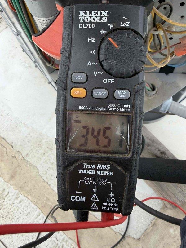 Completed commercial preventive maintenance inspection per customer care program agreement. Upon arrival, documented weather conditions showing incoming thunderstorms with potential impact on system operation. Performed comprehensive electrical diagnostics on air conditioning equipment, utilizing digital clamp meter to verify amperage draw reading 345A and confirm proper electrical performance across all phases. Inspected all electrical connections, contactors, and wiring for signs of wear or damage. System operating within normal parameters at time of service. All findings documented with photographic evidence for maintenance records.