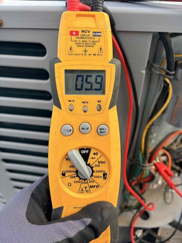 Completed spring maintenance clean and check on air conditioning and air handler system per comfort plan agreement. Performed thorough inspection of evaporator coil which showed significant dust and debris accumulation on fin surfaces, documented pre-cleaning condition, and conducted electrical diagnostics with multimeter to verify system performance and operating parameters. All refrigerant lines, connections, and components were inspected and system was returned to proper operating condition.