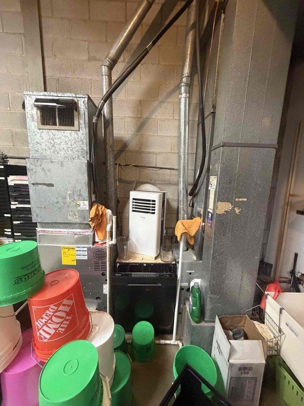 Completed spring preventive maintenance inspection on commercial HVAC system per prepaid maintenance agreement. Performed comprehensive checklist including system operational checks, documented equipment information and filter specifications for inventory updates. Noted active water management system with multiple collection buckets in place around equipment, portable AC unit present, and furnace left in OFF position per customer instructions at completion of service.