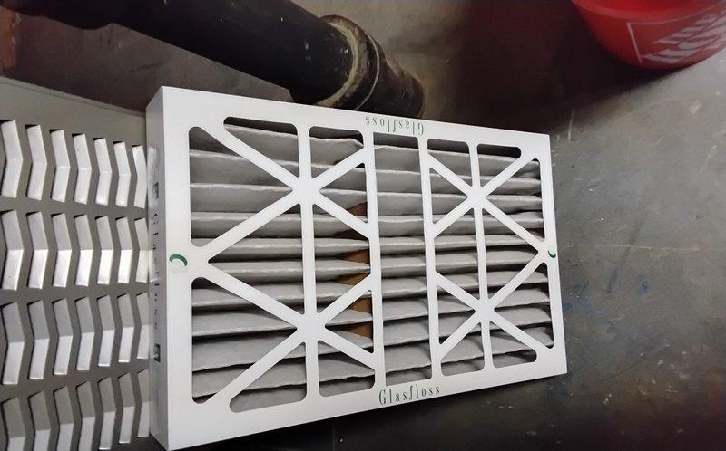 Completed spring clean and check maintenance on two air conditioning systems per comfort plan agreement. Replaced Glasfloss air filters on both units, with AC1 dating from 2004 and AC2 from 2017. Performed comprehensive inspection of furnace/air handler unit, ductwork connections including curved metallic elbows and black flexible ducts, verified proper operation of blue control components, and checked all associated piping and PVC connections. Updated equipment list with accurate system ages and specifications for service records.