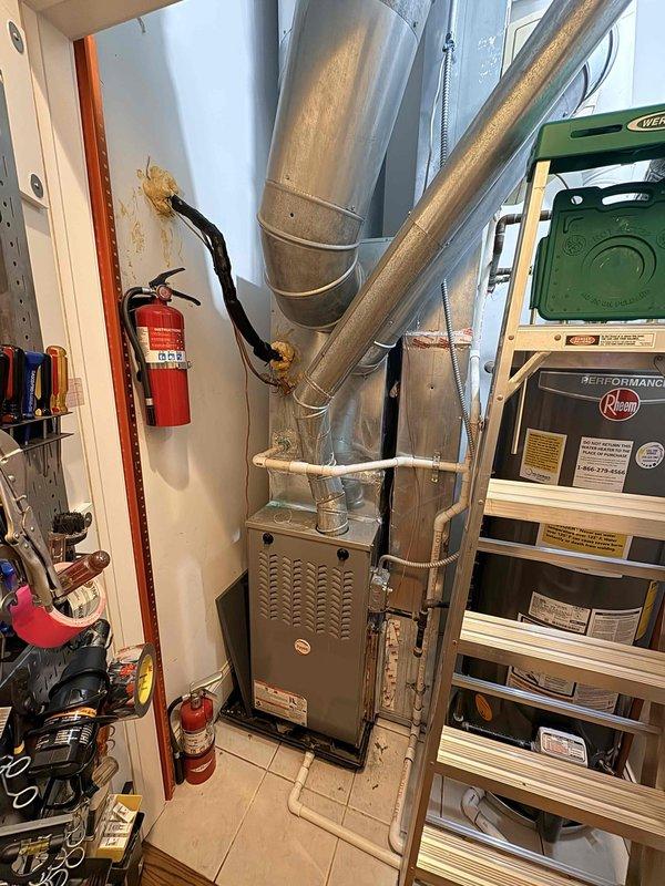 Responded to service call for rooftop air conditioning unit not cooling adequately. Accessed rooftop equipment using ladder to reach units mounted above parapet wall. Performed diagnostic evaluation of AC system, including visual inspection of condensing unit, electrical components, and refrigerant lines. Documented equipment information and captured photos of HVAC installation for service records. Discussed preventive maintenance options and system performance expectations with customer.