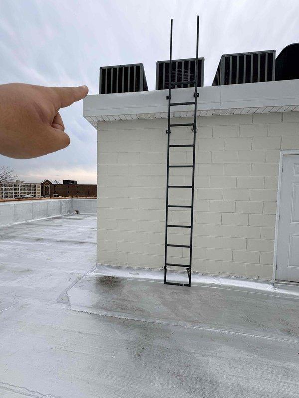 Responded to service call for rooftop air conditioning unit not cooling adequately. Accessed rooftop equipment using ladder to reach units mounted above parapet wall. Performed diagnostic evaluation of AC system, including visual inspection of condensing unit, electrical components, and refrigerant lines. Documented equipment information and captured photos of HVAC installation for service records. Discussed preventive maintenance options and system performance expectations with customer.