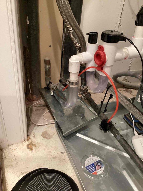 Responded to warranty callback regarding reported noise from recently installed HVAC unit and concern about missing sensor. Performed thorough inspection of attic installation, verified all components present and properly installed including temperature sensors, ductwork connections, and damper assembly. Documented supply plenum temperature reading of 130.2°F indicating proper system operation. Inspected condensate drain assembly with float switch, confirmed proper drainage function and verified drain pan collecting condensation as designed. All installation components accounted for and functioning within manufacturer specifications, no missing parts identified.