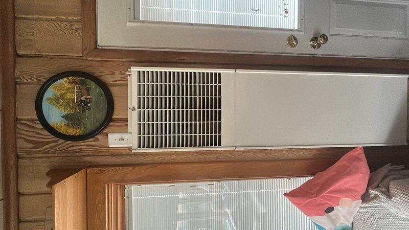 Performed site assessment for replacement of 30+ year old Williams wall furnace with new Rinnai room heater in family room. Evaluated existing installation, documented current wall-mounted heating unit configuration, and assessed electrical connections and venting requirements for proposed Rinnai heater upgrade.