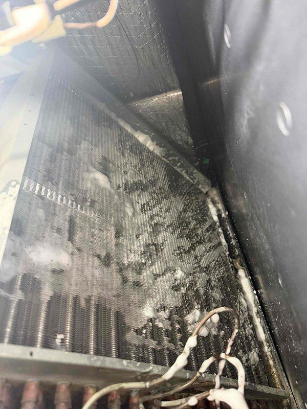 # Evaporator Coil Cleaning

Performed comprehensive cleaning of the indoor evaporator coil, which exhibited significant accumulation of dust, dirt, lint, and debris between the metal fins. Accessed the air handler unit and thoroughly cleaned the coil surfaces to restore proper airflow and heat transfer efficiency, removing visible contamination and buildup that was restricting system performance.