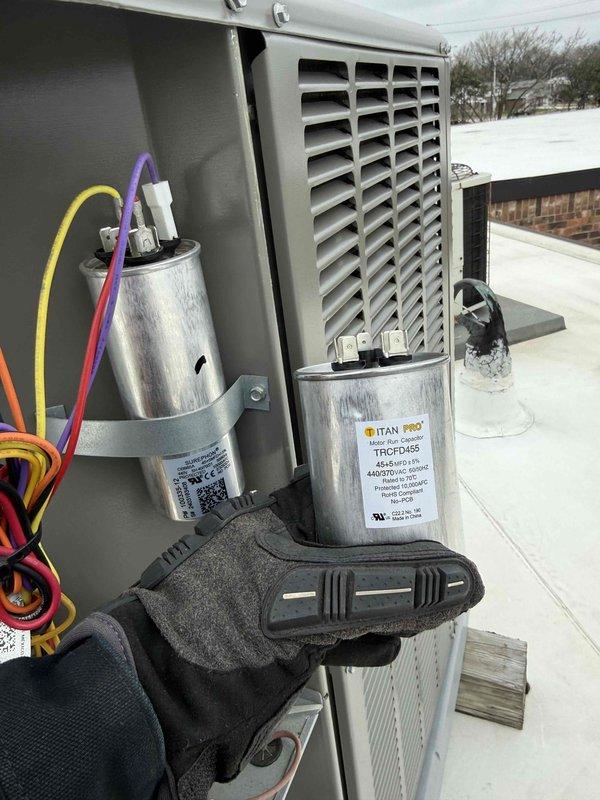 Responded to commercial rooftop HVAC unit requiring capacitor replacement. Upon inspection, diagnosed failed run capacitor preventing compressor operation. Removed defective capacitor and installed new TITAN PRO TRCFD455 replacement capacitor with proper electrical specifications. Verified all wire connections were secure, tested unit operation, and confirmed system returned to normal cooling function.
