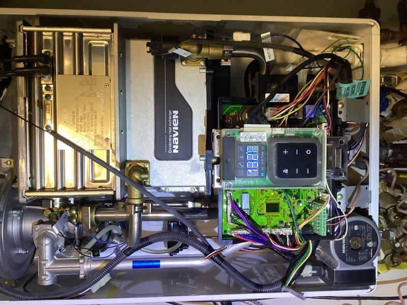 Replaced failed flame rod assembly on Navien tankless water heater. Unit was experiencing ignition issues due to corroded flame sensor, which was preventing proper burner operation. Installed new OEM flame rod assembly, tested system operation, and verified proper ignition sequence and flame detection functionality.