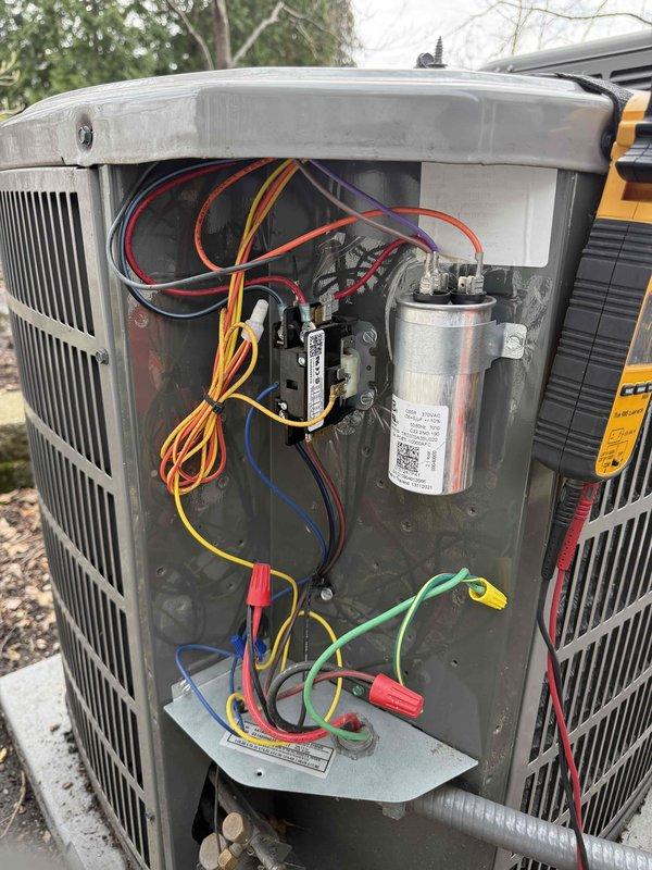 Completed comprehensive clean and check maintenance on two air conditioning systems and two air scrubber units per the Gold Comfort Plan agreement. Performed thorough inspection of outdoor condensing units, including visual examination of electrical components, capacitors, contactors, and wire connections to verify proper operation and safety. Utilized digital clamp meter to measure amperage and electrical parameters on both systems, confirming all readings were within manufacturer specifications. Inspected condenser coils for cleanliness and airflow efficiency, documented system conditions with detailed photographs of internal components and diagnostic measurements for service records.